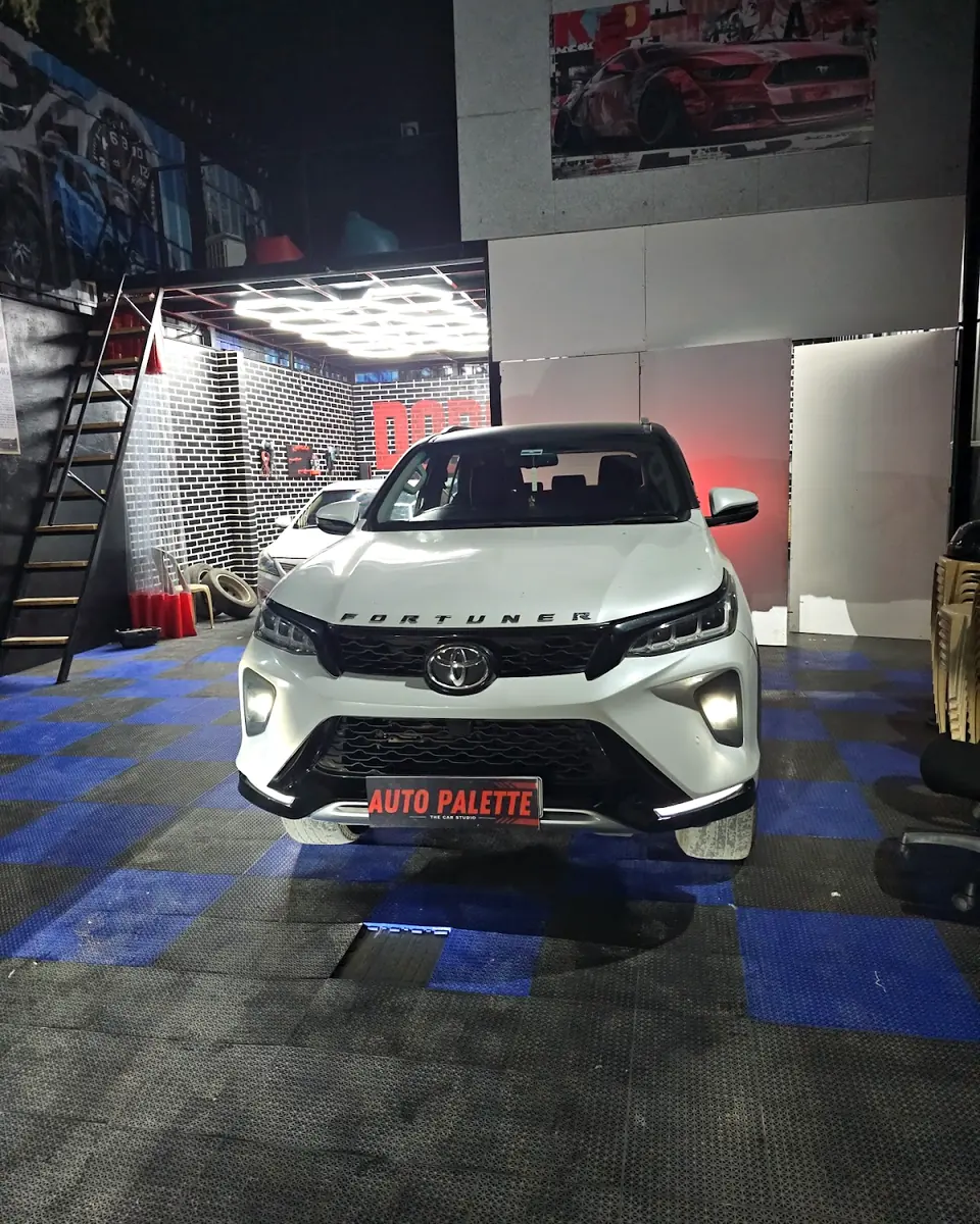 White Toyota Fortuner in the studio at night