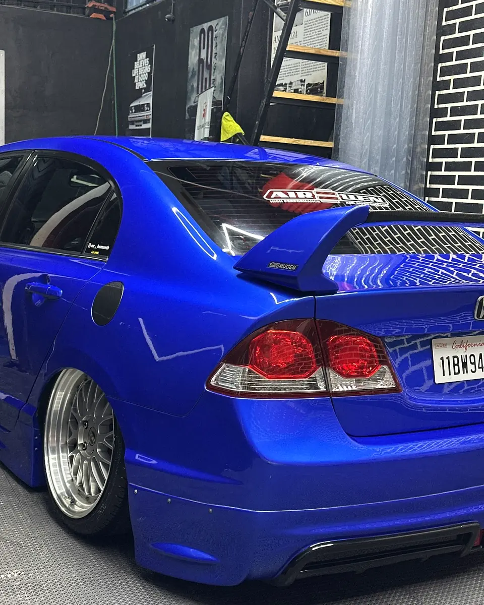 Rear of a blue Honda in the Auto Palette studio