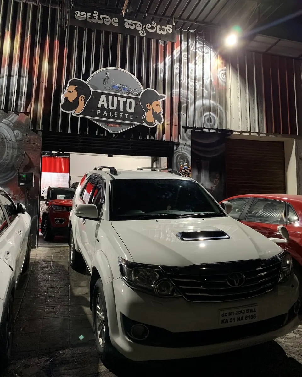 White SUV parked at the studio shutter