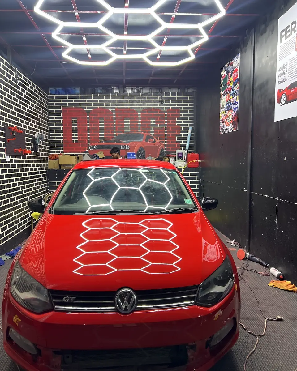 Red Volkswagen in the Auto Palette detailing bay