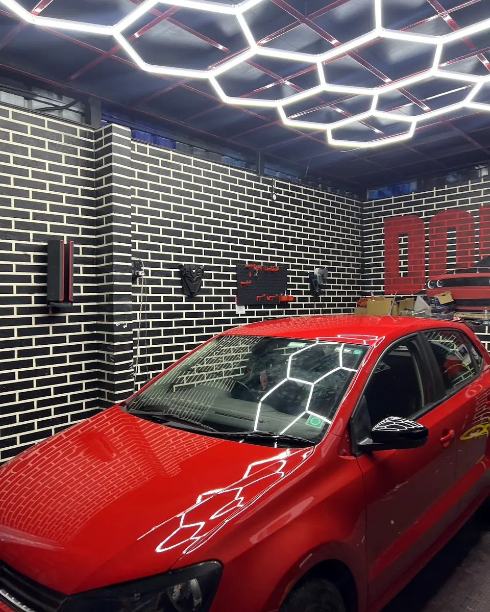 Red hatchback in the detailing bay