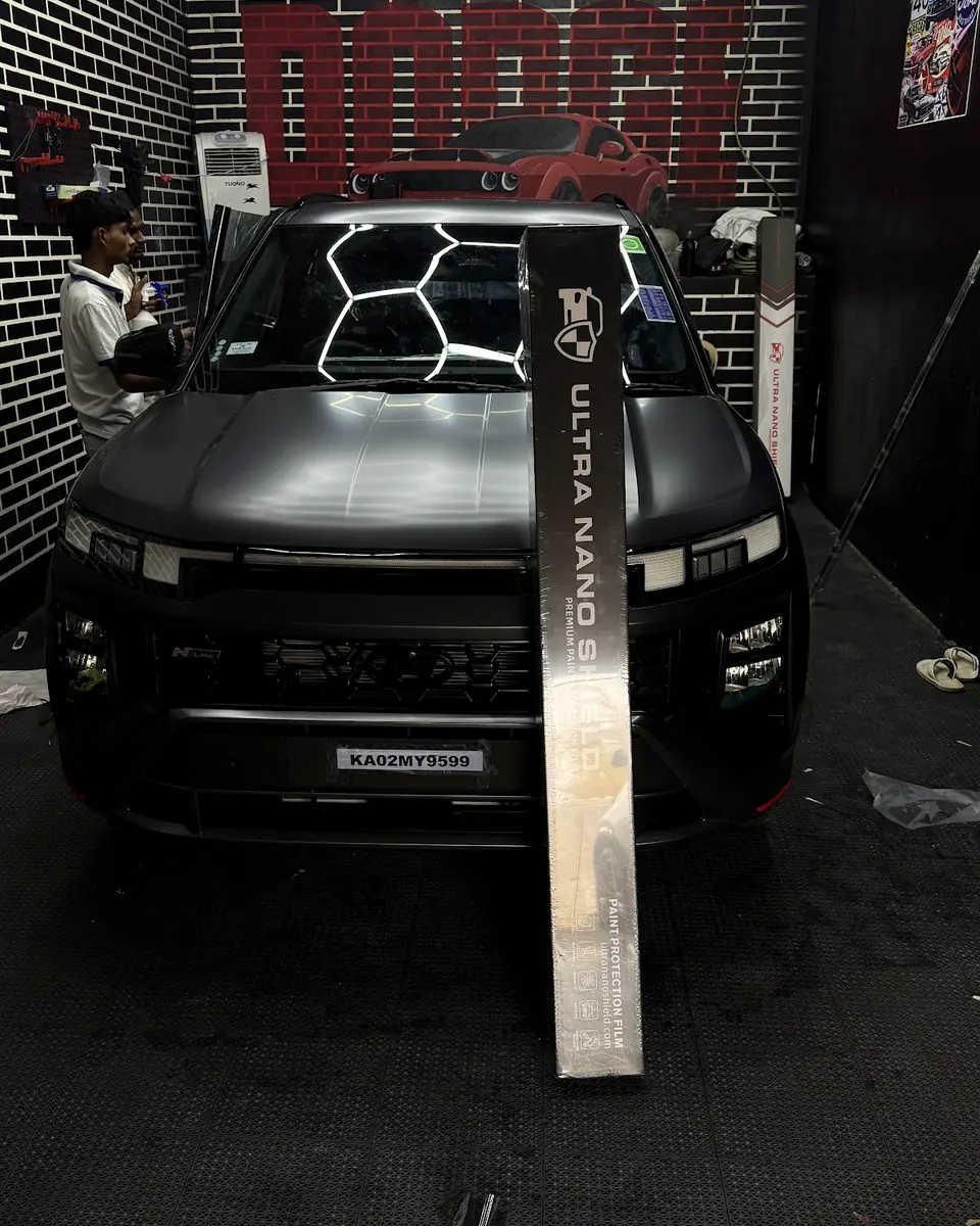 Dark SUV in the detailing bay